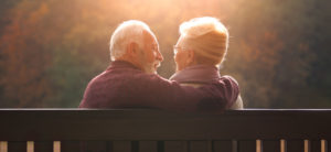 elderly couple looking at each other